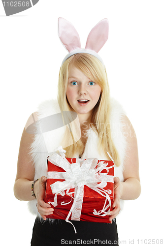 Image of Happy smiling girl with a gift - rabbit