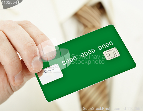 Image of Green electronic plastic card in hand