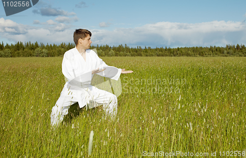 Image of Young karateka trains in open air