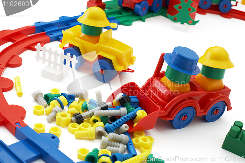 Image of Toy bulldozer and railway on white background