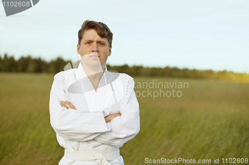 Image of Man in white kimono against evening nature