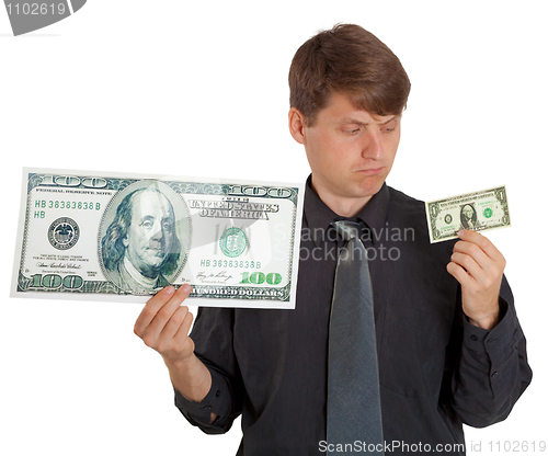 Image of Businessman feels difference between large and small money