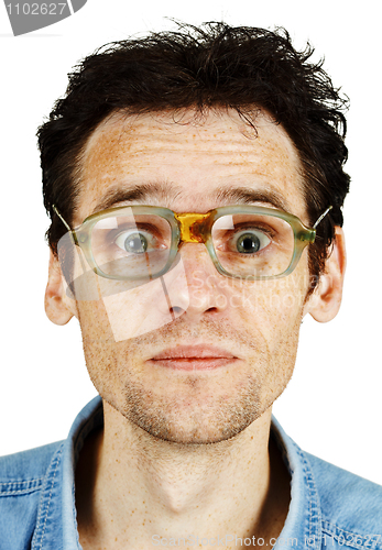 Image of Amusing tousled man in old ridiculous spectacles