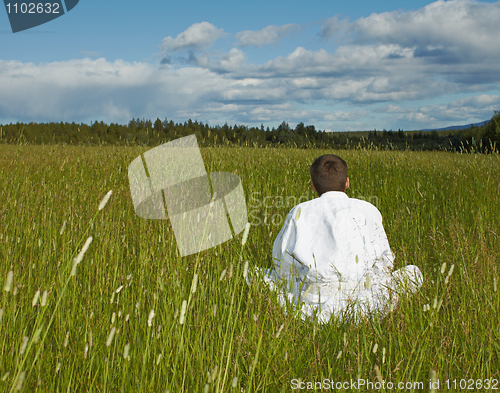 Image of Person is meditation far away from civilization