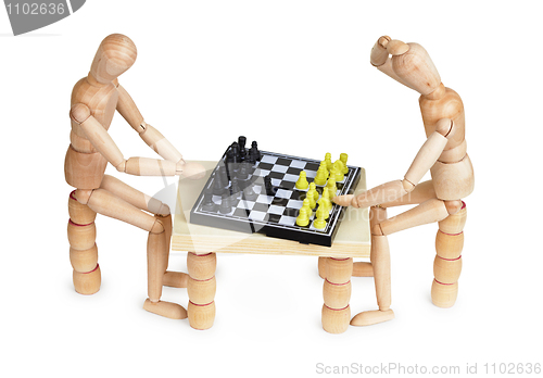 Image of Toy people play chess