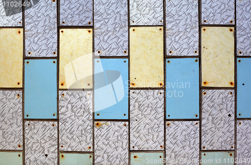 Image of Wall with old plastic tiles of various colors