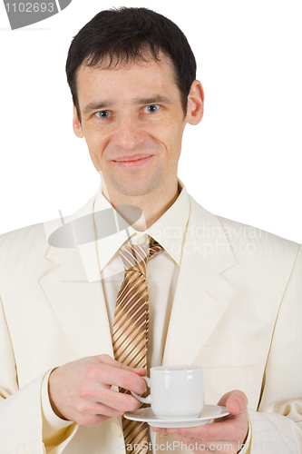 Image of Happy young man with cup of coffee