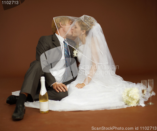 Image of Bride and groom kissing