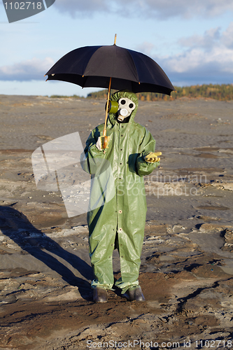 Image of Person with umbrella waits radioactive rain
