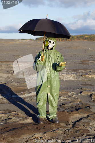 Image of Person with umbrella waits radioactive rain