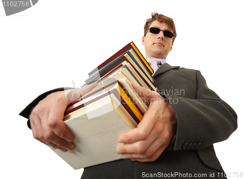Image of Blind man holding stack of books