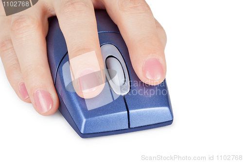 Image of Hand holds computer mouse close up