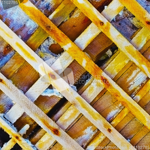 Image of Damaged ancient wall - bared wooden skeleton