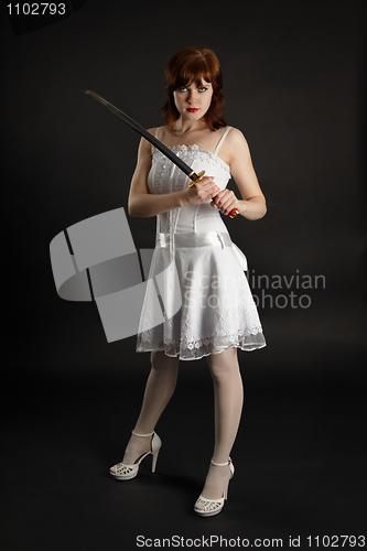 Image of Beautiful girl armed with sword