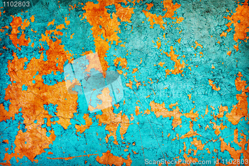 Image of Abstract texture - wall covered with peeled blue and orange pain