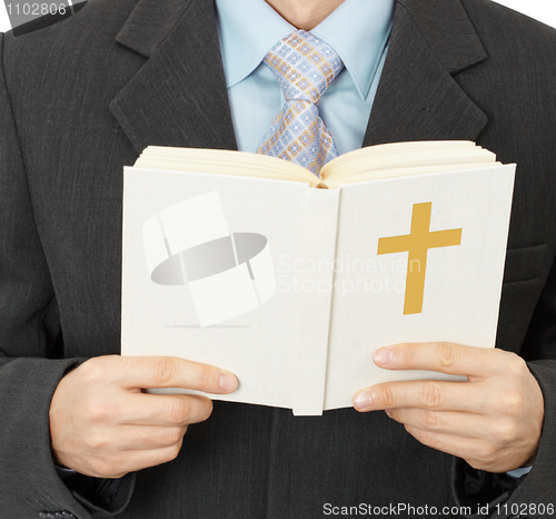 Image of Man reads Catholic Bible