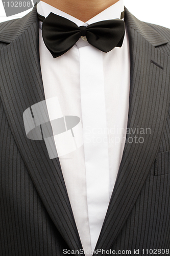 Image of Breast of young man in tuxedo with bow tie