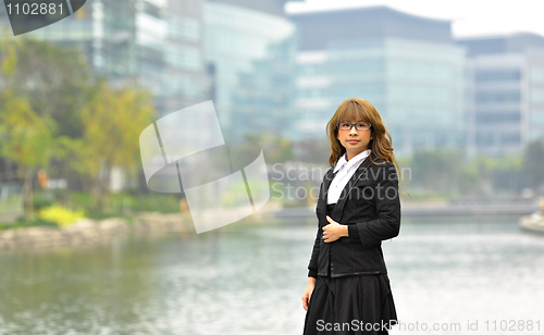 Image of young business woman in business area