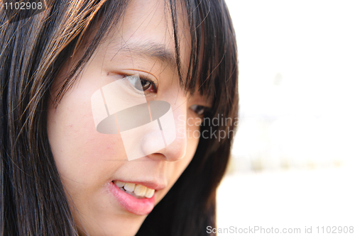Image of face of young asian woman