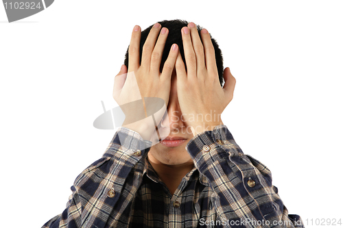 Image of young man cover his eyes