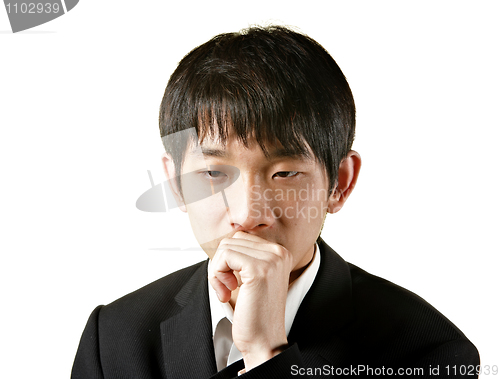 Image of young businessman thinking