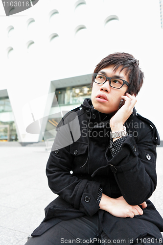 Image of man talking on mobile phone