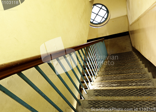 Image of Looking down at an old wooden stairs at an abandoned building