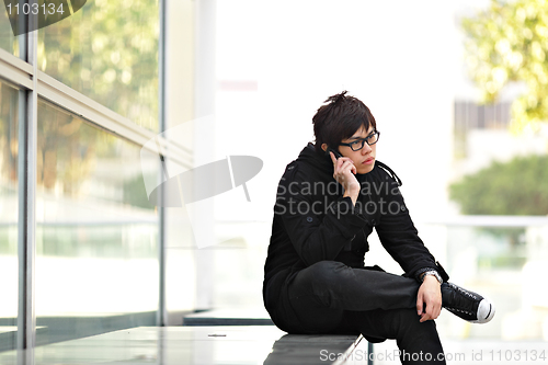 Image of man talking on cellphone