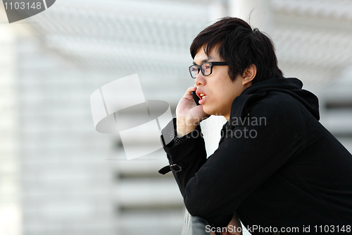 Image of Businessman talking on his cellphone