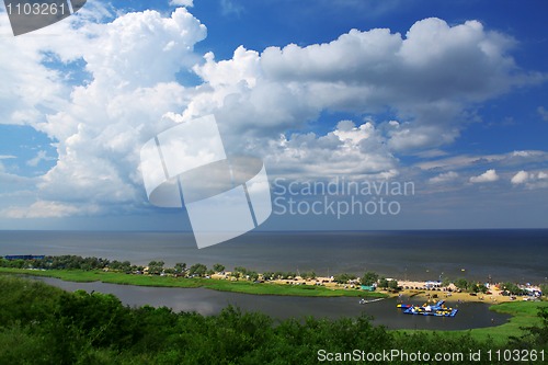 Image of Coastline and fluffy clouds