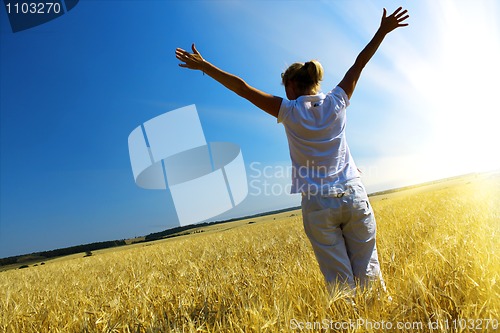 Image of Woman in wheaten field