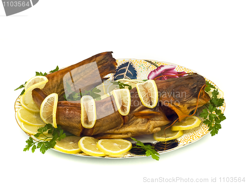 Image of Tasty dinner - bloated fresh-water catfish on the plate