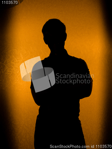 Image of Back lit silhouette of man 