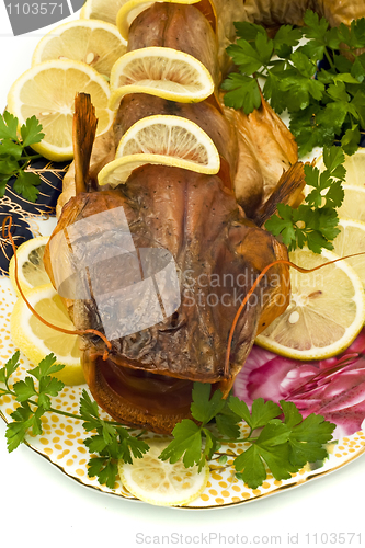 Image of Shore dinner - smoke-dried sheatfish with lemon