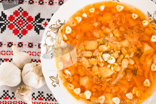 Image of Borsch and heads of garlic