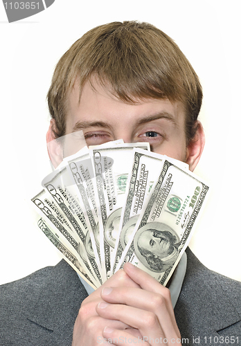 Image of Happy winking businessman holding money