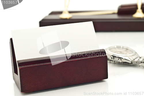 Image of Close-up of Card holder with blank white business card