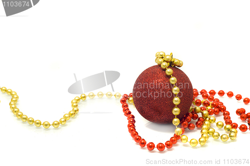 Image of Christmas is coming. Red Decoration ball, red and golden tinsel 