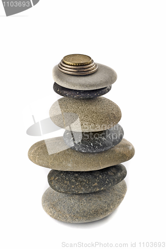 Image of Stability, wealth and welfare - stone stack with coins