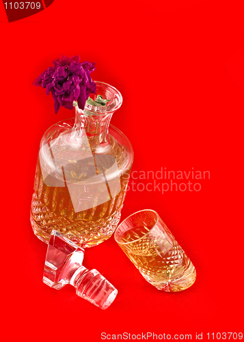 Image of Crystal decanter with jigger for alcoholic beverage and flower