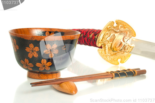 Image of Katana, Chopsticks and bowl over white