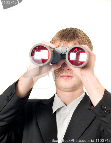 Image of Businessman with binoculars searching for something