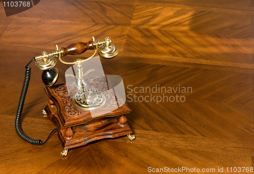 Image of Old-fashioned telephone on table