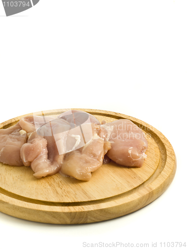 Image of Close-up of raw Chicken fillet on hardboard