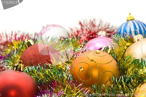 Image of Xmas greetings - colorful decoration balls and tinsel