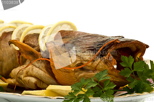 Image of Shore dinner - tasty smoke-dried sheatfish with lemon and parsle