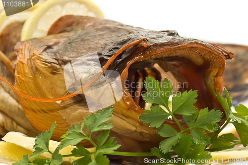 Image of Shore dinner - Bloated sheatfish with lemon and parsley