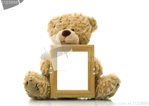 Image of Cute bear holding empty frame for picture or photo