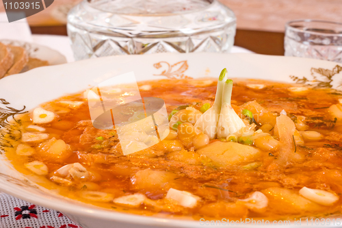 Image of Plate with Borsch and jigger of vodka