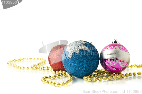 Image of Christmas decoration - red, pink and blue balls with beads